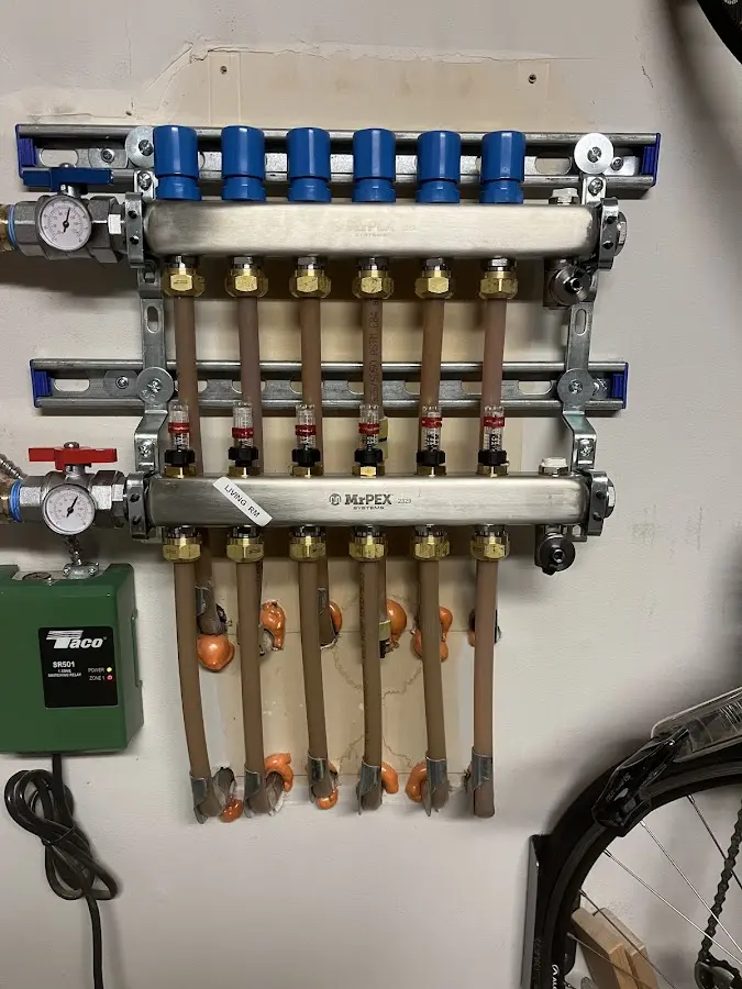 Plumber performing Water Heater Repair at a residential property in Anoka